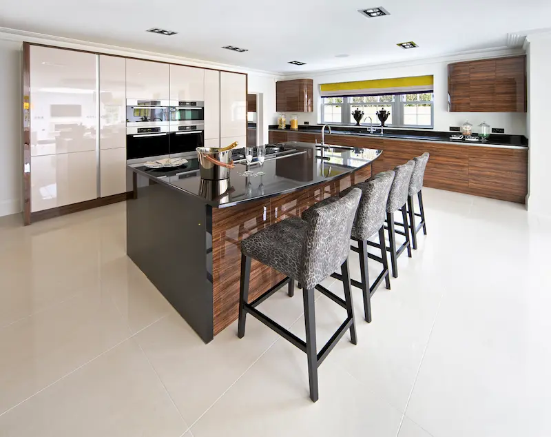 Modern home kitchen with built-in white paneled luxury brand appliances 